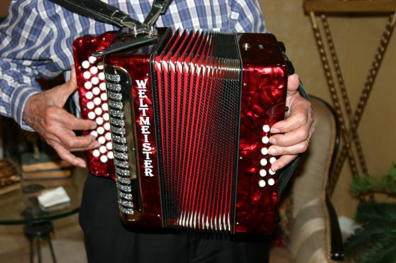Agapito Zuniga playing accordion